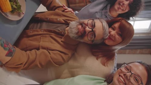 Four Happy Friends Smiling for Camera Indoors