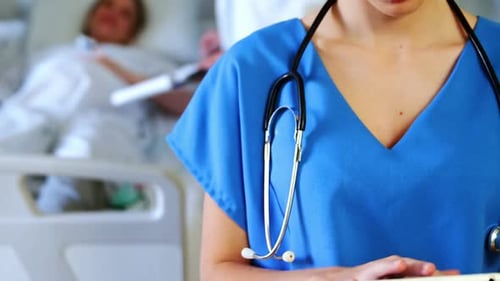 Portrait of female doctor using digital tablet in hospital