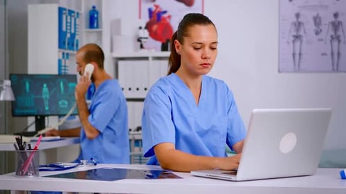 Medical Professionals Working in Bright Office with Technology