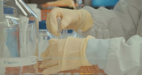 Scientist Experimenting with Liquid in a Laboratory