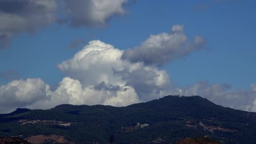 Clouds And The Mountain