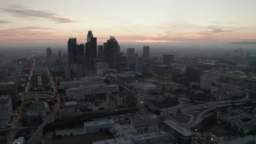 AERIAL: Breathtaking View of Skyscrapers in Downtown Los Angeles, California at Beautiful Sunset