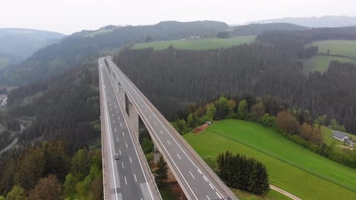 Aerial View of the Highway Viaduct on Concrete Pillars in the Mountains