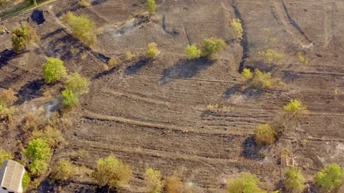 Drone view of fire on field. Aerial view of dry grass field in fire