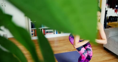 Woman Doing Yoga in Her Home Gym