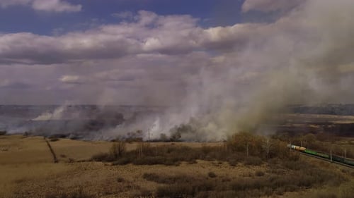 Field Fire Creates Billows of Smoke and Destruction