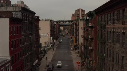 Low Flight Through Chinatown, New York City Street with Chinese Asian Letters Towards Bridge