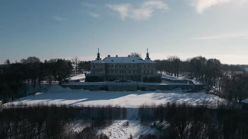 Aerial View Drone Flight Forward Over the Historic Old Castle at Sunny Winter Day Pidhirtsi Palace