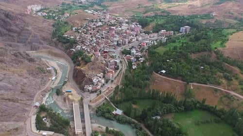 Skewed Urbanization in the Valley Between the Arid Steppe Mountains