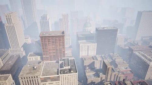 Aerial View of Modern City Buildings Through Foggy Haze