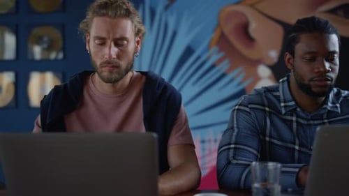 Business Professionals Working Together on Laptops