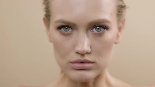Woman's Beauty Face With Makeup Close Up