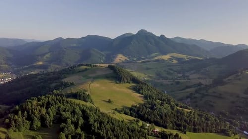 Aerial Green Countryside Landscape in Alpine Mountains Summer