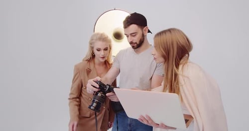 Fashion Shoot Team Reviews Camera on Set