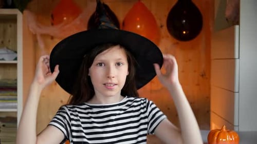 Teen Girl Wearing Witch Hat and Surgical Mask