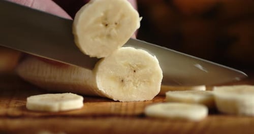 Slicing a Banana on Cutting Board