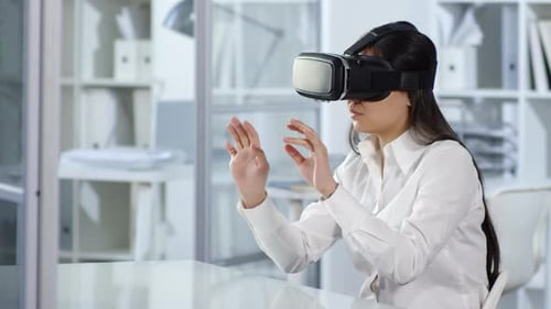 Asian Woman Working with VR Headset in Office