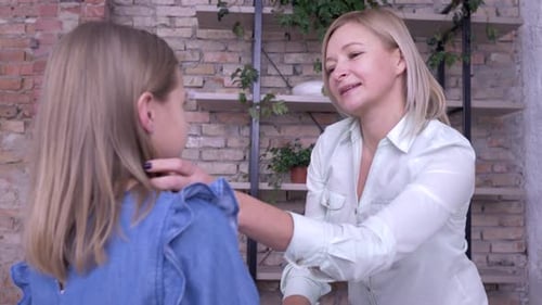 Loving Mother Shares Affectionate Moment with Daughter