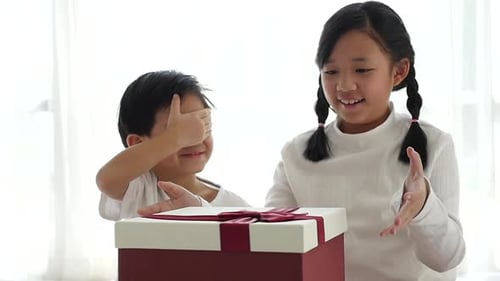 Children Open Gift Box with Delight