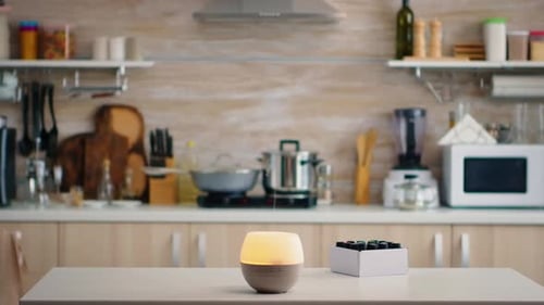 Aromatherapy Diffuser Emitting Smoke in Kitchen Interior