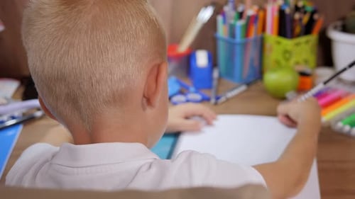 Child Drawing at Desk, Brightly Lit