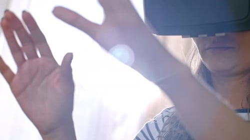 Woman Wearing VR Headset Using Technology