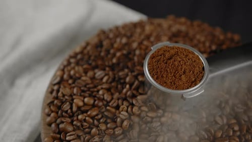 Finely Ground Espresso and Steaming Coffee Beans