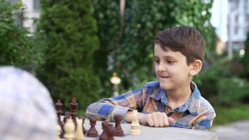 Close Up of Little Genius Boy Chess Player