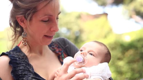 Mother with her baby daughter at park spending some quality time together