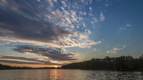 Stunning sunset over the lake in summer, timelapse, 4K