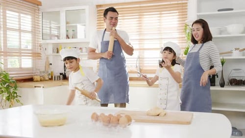 Happy Family Cooking Together in Kitchen