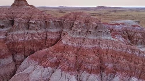Flying backwards revealing red desert mars like landscape in Wyoming