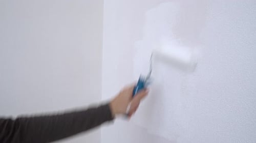 Hand Painting White Wall With Roller