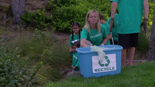 Group of volunteers cleaning up park