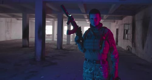 Soldier Armed with Rifle Inside Derelict Urban Building