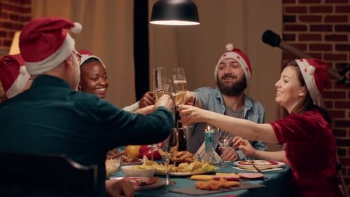 Friends Celebrating Christmas with Champagne Toast at Home