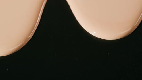 Flowing Foundation Tone on Black Background