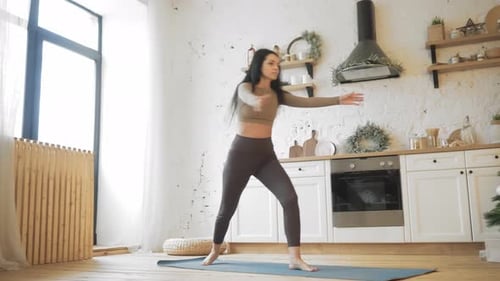 Woman Practicing Yoga Balance Pose at Home