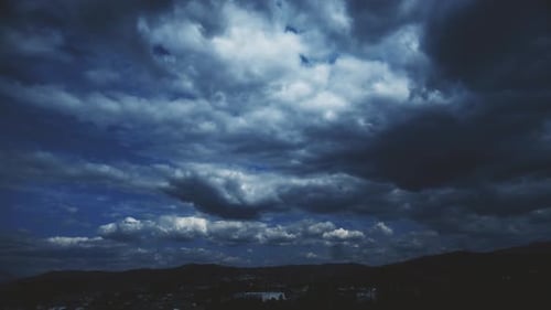Ominous Sky Above Dark City Clouds
