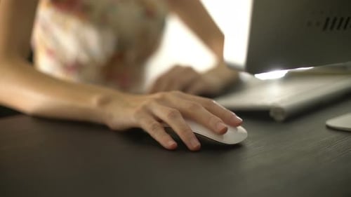 Surfing Website On Computer With Wireless Mouse