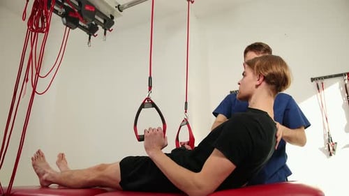 Man Receiving Physical Therapy From Medical Professional