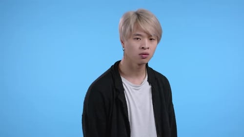 Asian Furious Man on Blue Background