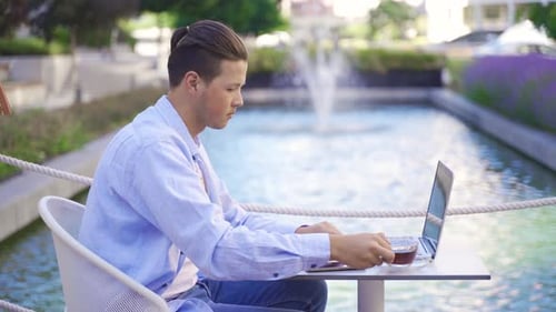 Working with laptop in the garden.