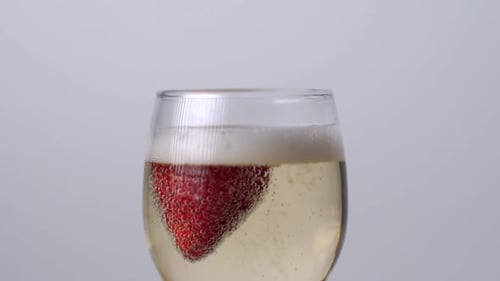 Strawberry Plunging into Glass of Champagne