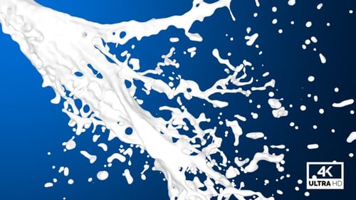 Milch fließt mit Spritzer