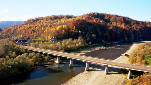 Road Bridge Over Narrow River Leading to Terracotta Forest