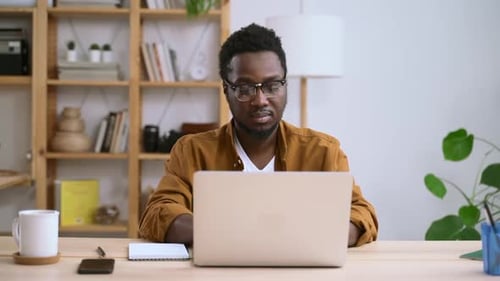 Businessman Working with Laptop and Having Break at Table in Home Office Spbas