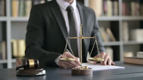 Close Up of Lawyer Hands Writing Documents in Court Room