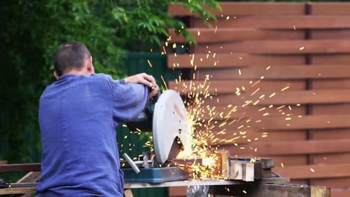 Worker Man Cut Metal Saw for Welding Spark Material. Working Tool Sawing Closeup