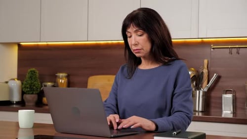 Tired Aged Woman Works Laptop Rubs Neck Stretches Tense Muscles Long Hard Work